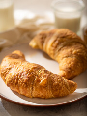 French croissant with jam. morning breakfast. On a light background