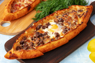 Close up of Turkish Pide bread on wooden table