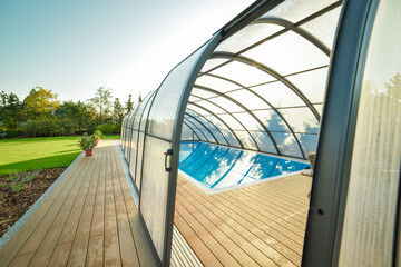 Polycarbonate Swimming Pool Cover in the garden - obrazy, fototapety, plakaty