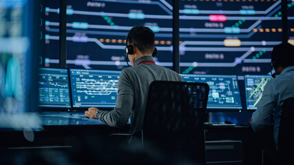 Professional IT Technical Support Specialists and Software Programmer Working on Computers in...