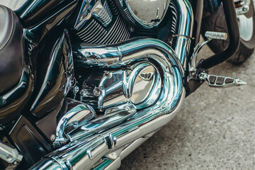 Chromed motorcycle engine part. Motorcycle exhaust system