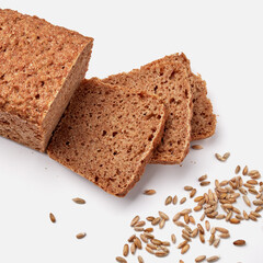 sliced rye bread on a white plate with pumpkin seeds