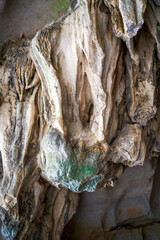 Close-up of stalactites in a cave in a valley