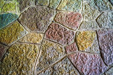 Multicolored slate floor stitching into a background