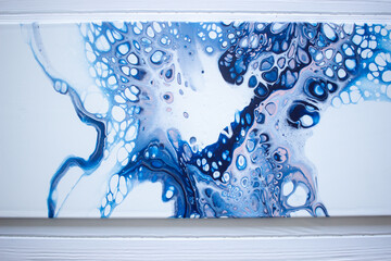 Acrylic painting texture closeup, fluid art painting, acrylic pouring paint texture, blue, white, and pink paint splashes
