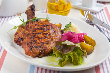 pork loin on coals with potatoes and cabbage