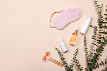 Bottles of essence or serum with natural eucalyptus leaves