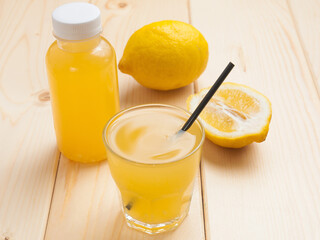 ginger lemonade in a bottle and in a glass. Concept: food delivery