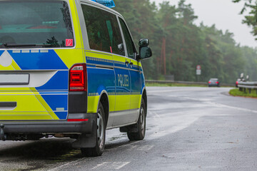 Side view of a police car. Vehicle in an emergency parking bay Police vehicle in blue and yellow...
