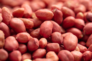 Close up of peanut nuts as background. Macro