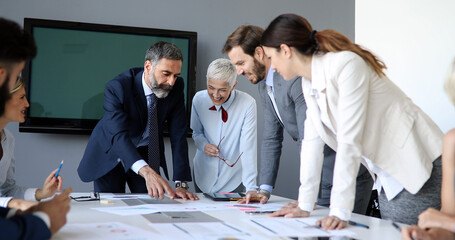 Group of architects and business people working together and brainstorming
