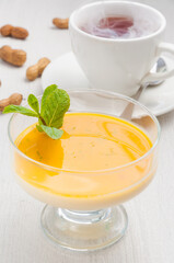 delicious Pana cotta dessert with mango and hot tea
