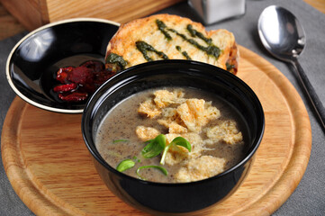 mushroom soup puree with croutons toast and sun dried tomatoes
