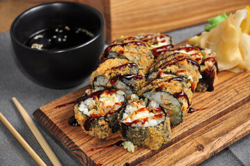 tempura roll with salmon on a wooden Board