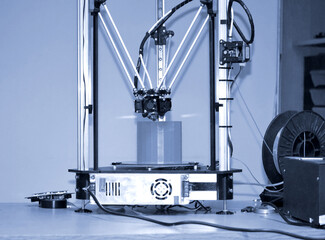 Modern 3D printer printing figure close-up. Automatic three dimensiona