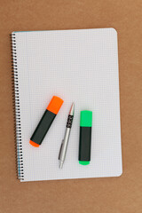 Notebook, pen and markers