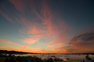 Abstract nature background. Dramatic and moody pink, purple and blue cloudy sunset sky