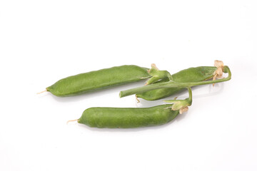 Pods of green peas with leaves isolated on white background