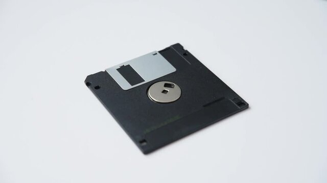 Floppy disk falls on the white table