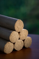 Six moxa sticks are placed on the wooden table top.  Wormwood.  Traditional Chinese medicine treatment of moxa.