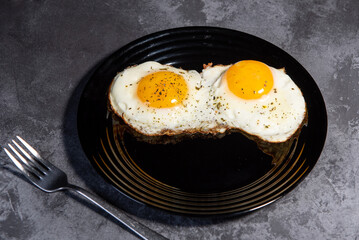 fried eggs, delicious breakfast, snack, yolk and protein food, background, top view, copy space, eat healthy raw. Scrambled eggs. Close-up