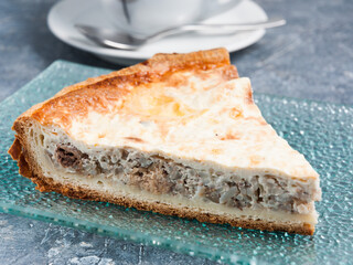 tasty slice of tuna pie on a glass plate