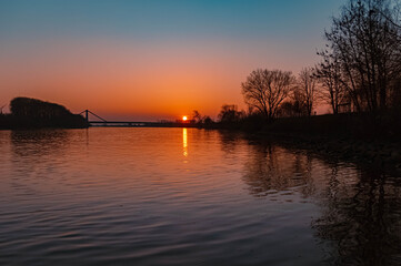 Beautiful sunset with reflections near Metten, Danube, Bavaria, Germany