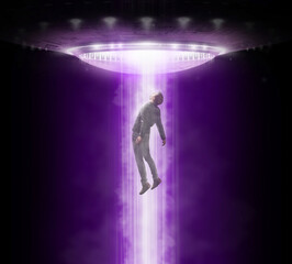 Man being abducted by UFO