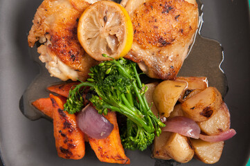 fried chicken thighs and vegetables