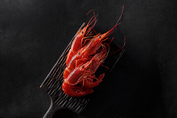 Top view of raw giant red prawns on serving board