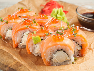 Philadelphia salmon sushi rolls with soy sauce. Close up