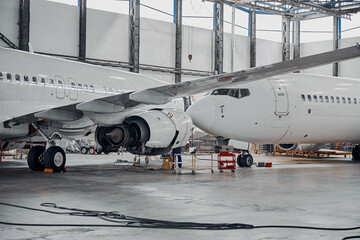 Professional plane expluatation service in big hangar