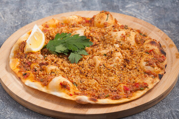 lahmacun with walnuts is a Turkish dish similar to a pizza