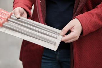 Woman in a building materials store buys nadfils and rasps of different shapes. Hands close up...