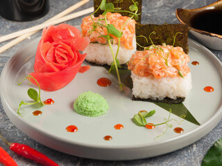 sushi roll with chopped salmon and nori seaweed. Asian cuisine