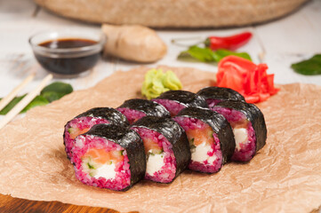 pink rolls with salmon cheese and cucumber in nori seaweed