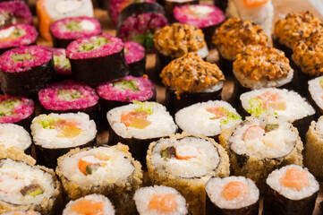 tasty assorted sushi rolls background for layout