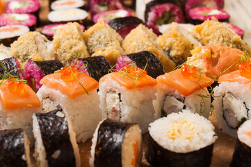 tasty assorted sushi rolls background for layout