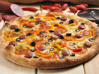 Bavarian pizza with sausages bell peppers and olives