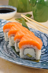 Philadelphia sushi roll with salmon and avocado. Close up