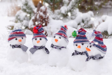 Five cute snowmen  dressed for winter
