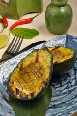 Soft and delicious grilled avocado.Close up. Healthy diet. Vegetarian food