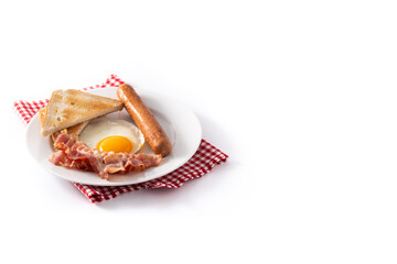 Traditional American breakfast with fried egg,toast,bacon and sausage isolated on white background. Copy space