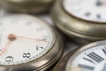 Scenic view of old pocket watches on white background