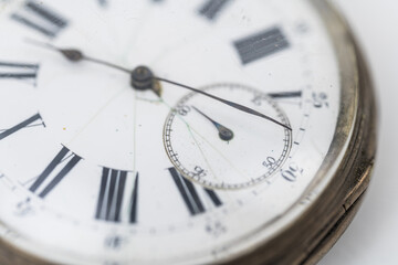 Close up view of pocket watch on white background