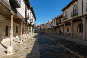 Obraz premium Streets with a traditional Castilian architecture with its houses with arcades in Ampudia, Palencia, Castilla y León, Spain.