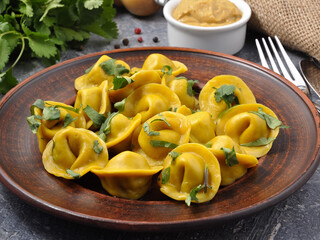 tasty Russian yellow dumplings with mustard sauce