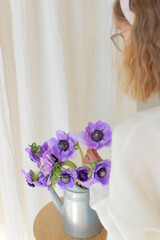 Delicate flower bouquet. Wrapped flowers bouquet. Fresh beautiful flower in hand.