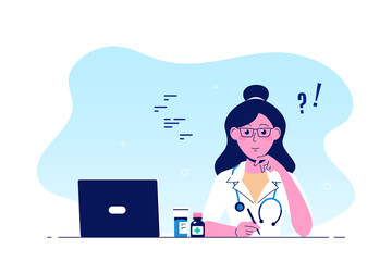 Woman doctor sitting at the table in the office.