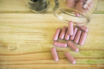 Medical supplies for treating various diseases on wooden backgrounds, patterns and colors